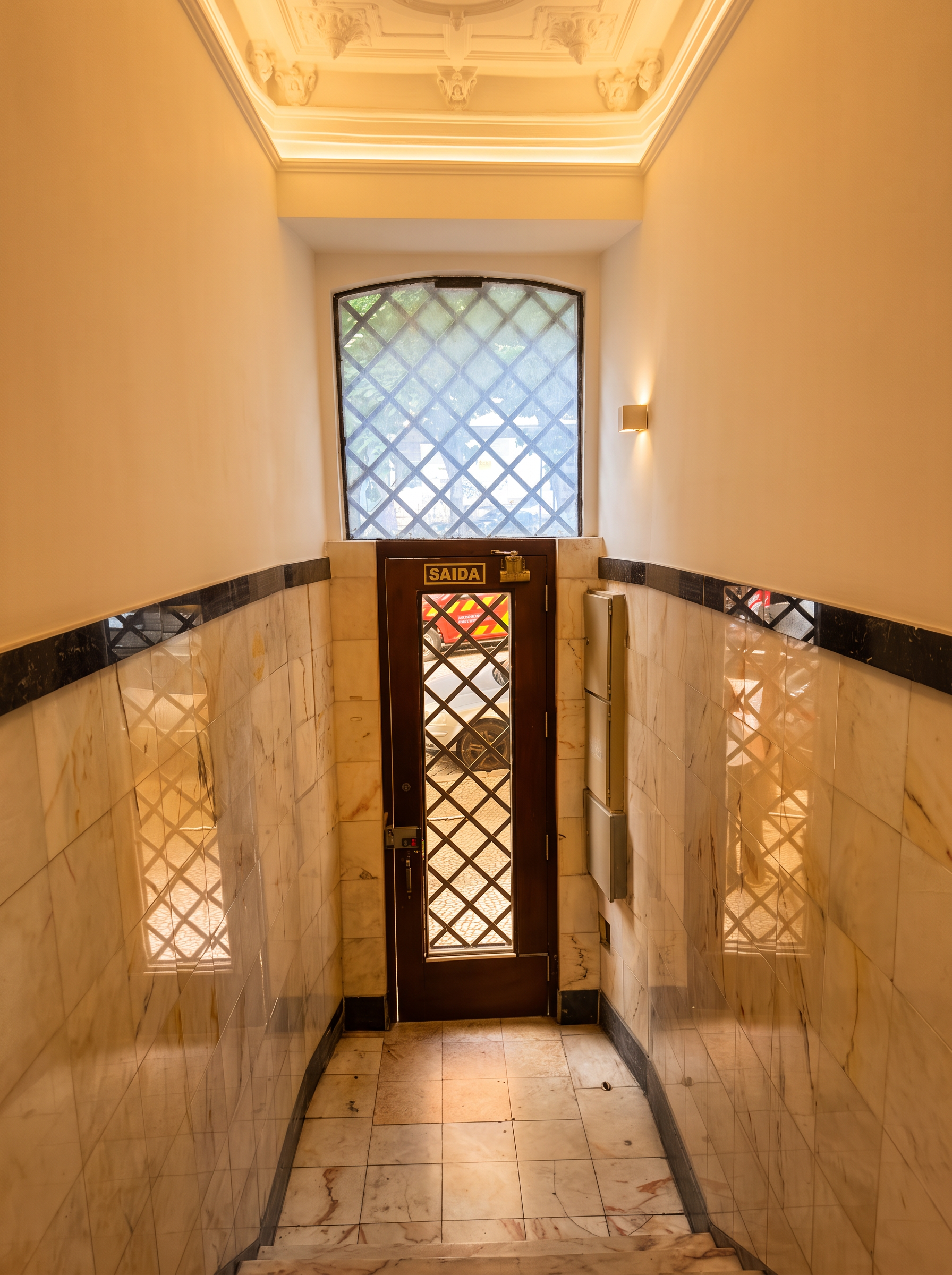 Marble-lined entrance hall of the Pombaline building in warm light